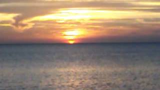 Haitian Family Walking along beach at Sunset