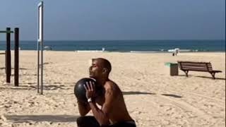 working with slam ball at the beach