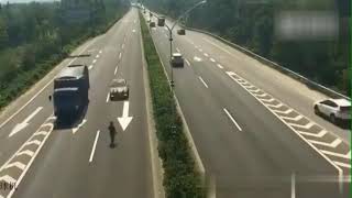 LiveLeak - Man walking on the highway gets hit by a car