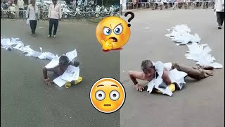 A person rolled hundreds of complaints around his body for 7 years in front of collector's office