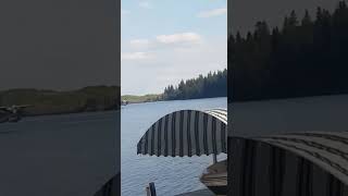 Plane taking off on lake