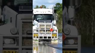 4 trailer road train driving in flood water