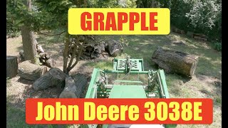 John Deere tractor 3038e   grapple   to big to lift & move   so we will push it