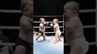 Two babies fighting like real men