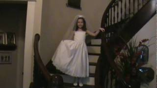 First Communion Julienne walking down stairs before.mpg