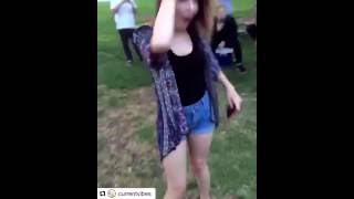 Guy tries to kick water bottle off girls head