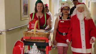 Handing out Christmas presents in aged care