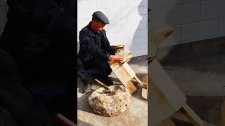 Craftsmen are making a traditional wooden saddle