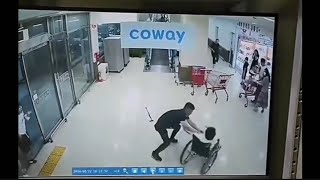 An old woman in a wheelchair was lost control and rushed down too fast. A random guy save her.