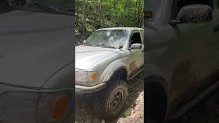 Dual cased TOYOTA TACOMA climbs rock garden at windsock park