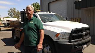 A roofing and solar company owner discusses some of his multipurpose work trucks