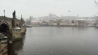 4K Snow Blizzard: A Winter Wonderland View of Prague Castle from Charles Bridge.