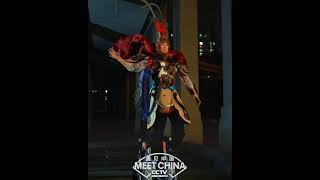 Chinese guy with Chinoiserie dress-up imitates ancient Chinese characters with special effects.