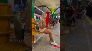 Girl changes her shoes on the subway