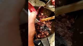 The making of Dinuguan (bloody pork).