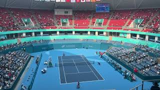 Long-distance returns are staged at the Wheelchair Tennis event