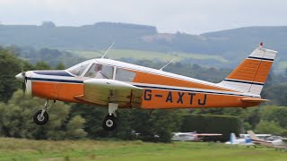 A PA-28 (G-AXTJ) Doing touch and goes at Newcastle Aerodrome.