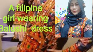 A Filipina Girl Wearing Balushi Dress