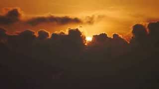 Maldivian sunset behind the horizon clouds