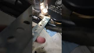 Oil drain copper washer drops onto skid plate.