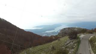 Car going on a road near the river, aerial view. Footage. Beautiful landscape picture of a scenic