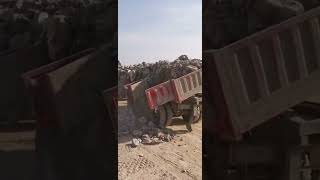 Side Dump trailer unloading rocks