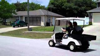 Daughter driving the golf cart