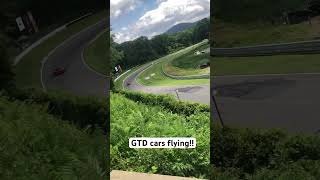 IMSA GTD cars fly down lime rock hill