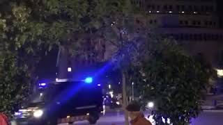 Man plays piano during chaotic anti-lockdown protest in Barcelona.