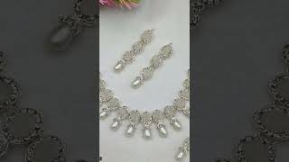 •  Material: Metal•  Golden Base•  Pearl Beads Work•  Size: Adjustable•  Set Inc