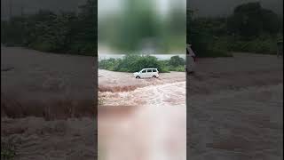 Car floats into river after heavy rain