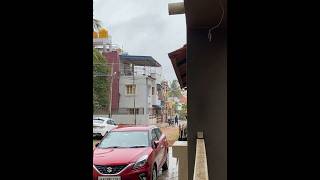 Two girls walk in the warm rain to reach their hostel