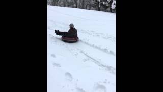 Sledding snowboarding