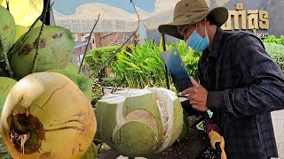 Amazing! Cambodian boy cutting coconut as fast as machine.