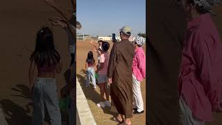 Camels at our farm are greeting a Kazakh family.