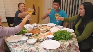 Family having fun with Spring Rolls