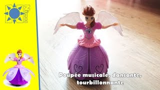 Poupée dansante, lumineuse, qui chante et qui tourne