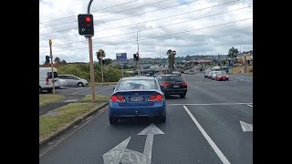 Driver illegally passes stopped vehicle and runs a red light to turn left