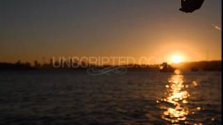 Hands Reel Fishing Line at Sunset (Stock Footage)