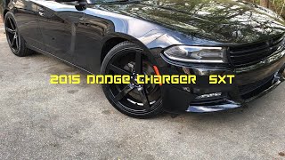 2015 Dodge Charger SXT sitting on  22”STR-607 black Wheels wrapped with 265/35-22 Lexani tires.