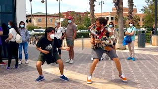 Street guitarist Challenged by Air Guitar Player - Funny reaction