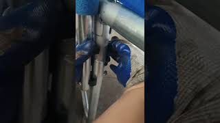 How to secure the bottom safety pole with hook and screws