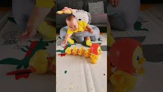 What a cute little duck. It's useful for kids to practice raising their heads and learn to crawl