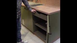 base unit with interior drawer behind a hinged door