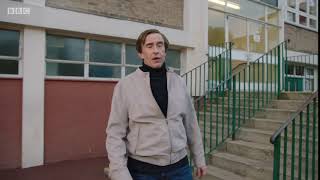 Alan Partridge slides down bannister hand rail stairs This Time With Alan Partridge